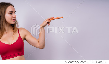 Woman opened her mouth and wants to bite off the sausage, close-up Woman opened her mouth and wants to bite off the sausage, close-up 109458492