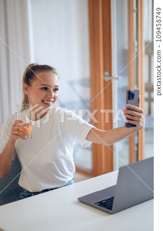 Cute smiling girl making selfie Cute smiling girl making selfie 109458749