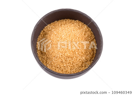 brown sugar in a dark bowl brown sugar in a dark bowl 109460349