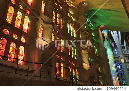 The church and colorful columns illuminated by the stained glass of Sagrada Familia 109460614