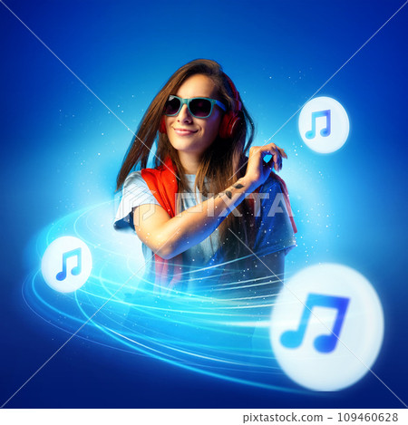Cool young woman listening music, rock in headphones against gradient blue background with flying notes symbolizing dynamic rhythm of melody. 109460628