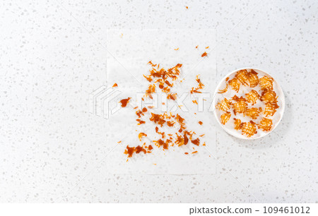 Flat lay. Crunchy caramel cupcake toppers on the counter. 109461012