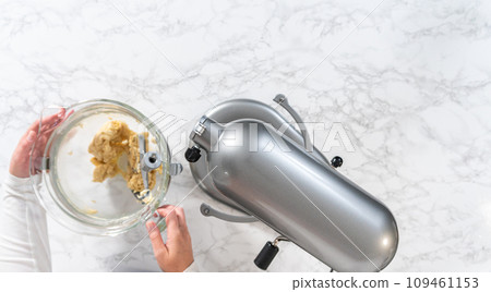 Flat lay. Mixing ingredients in kitchen electric mixer to bake panda-shaped shortbread cookies with chocolate icing. 109461153