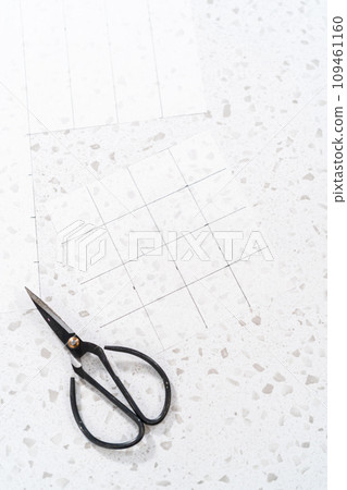 Preparing cutting template from parchment paper to cut homemade fudge. 109461160