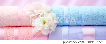 AI-generated content. soft towels in pastel colors with fresh flowers in the wellness center, banner 109462725