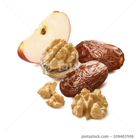 Slice of apple, walnuts and dates isolated on white background Slice of apple, walnuts and dates isolated on white background 109463506