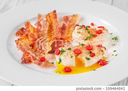 Poached eggs with bacon 109464841