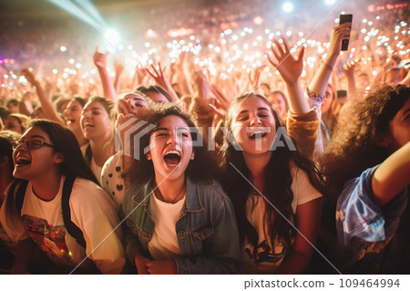 A close up photo of a group of teenager at a concert of their favorite band, night life, music festival event. happiness 109464994