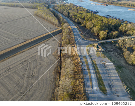 highway and Ohio River with barges below Cairo Illinois, November aerial view 109465252