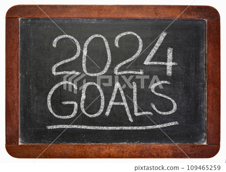 2024 goals  - handwriting in a white chalk on a vintage slate blackboard, New Year goals and resolutions concept 109465259