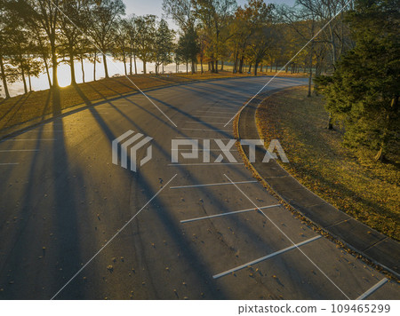 sunrise over the Tennessee RIver and parking lot in Colbert Ferry Park, Natchez Trace Parkway, aerial view of fall scenery sunrise over the Tennessee RIver and parking lot in Colbert Ferry Park, Natchez Trace Parkway, aerial view of fall scenery 109465299