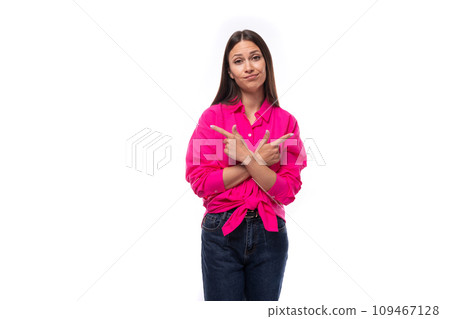 young cute caucasian brunette woman wears a pink shirt with tied ends at the waist 109467128