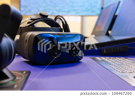 VR headset with cameras of with augmented reality lays on the desk, close up VR headset with cameras of with augmented reality lays on the desk, close up 109467260