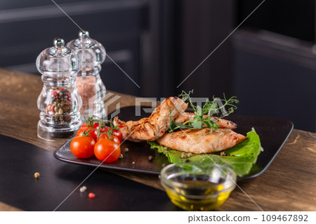 Fried chicken breast with herbs and tomatoes 109467892
