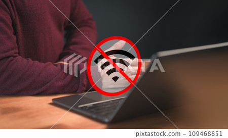 Technology concept of wifi connected but no internet. Man using a laptop computer to connect to wifi but wifi not connected or password is incorrect and waiting to loading digital data form website. Technology concept of wifi connected but no internet. Man using a laptop computer to connect to wifi but wifi not connected or password is incorrect and waiting to loading digital data form website. 109468851