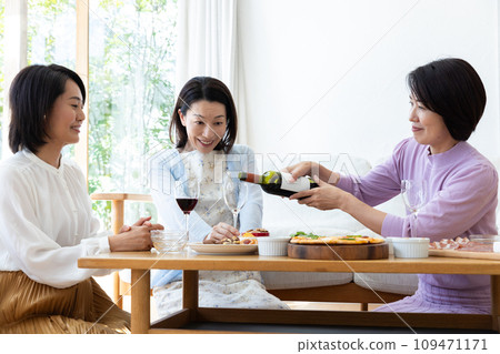 Women enjoying a home party Women enjoying a home party 109471171