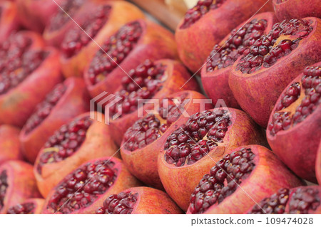 Bunch of Pomegranates on the greengrocer market. 109474028