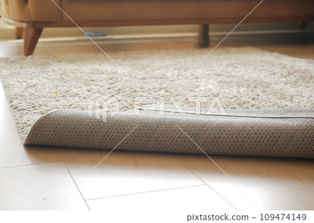 Carpet on the floor and sofa on background Carpet on the floor and sofa on background 109474149