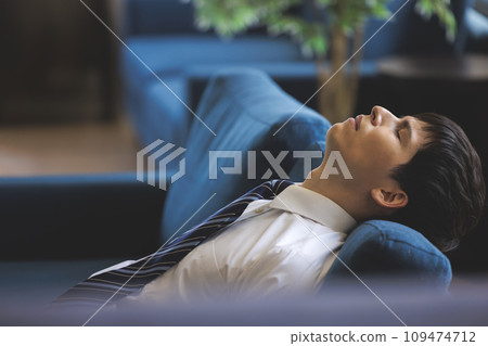 Male fatigue tired sofa 109474712