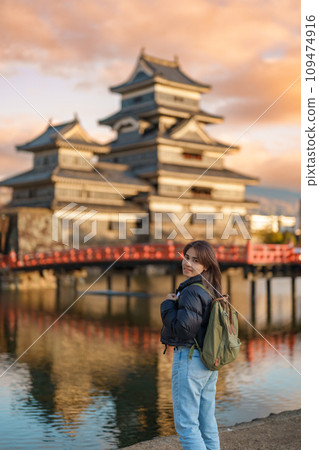 Woman tourist Visiting in Matsumoto, happy Traveler sightseeing Matsumoto Castle or Crow castle. Landmark and popular for tourists attraction in Matsumoto, Nagano, Japan. Travel and Vacation concept Woman tourist Visiting in Matsumoto, happy Traveler sightseeing Matsumoto Castle or Crow castle. Landmark and popular for tourists attraction in Matsumoto, Nagano, Japan. Travel and Vacation concept 109474916