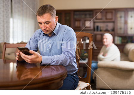 Adult son and elderly father are offended Adult son and elderly father are offended 109476156