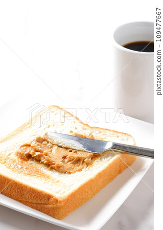 Breakfast with peanut butter bread and coffee 109477667