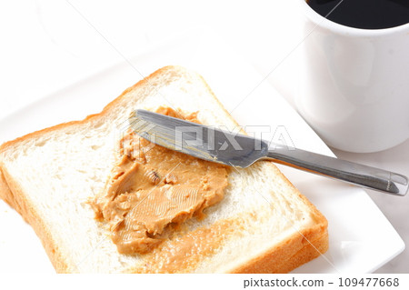 Breakfast with peanut butter bread and coffee 109477668