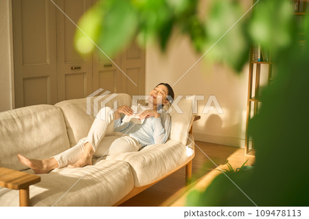 Woman sleeping on sofa 109478113