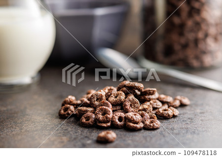 Sweet breakfast cereals on kitchen table. 109478118