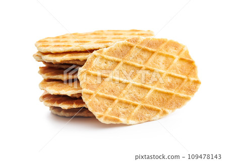 Round waffle biscuits isolated on white background. Round waffle biscuits isolated on white background. 109478143