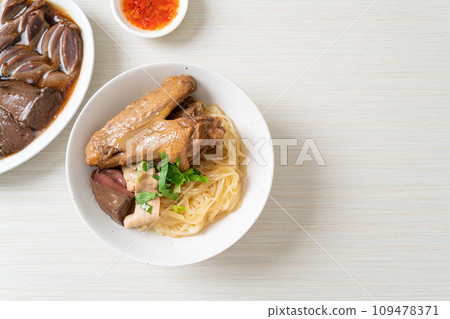 dried noodles with braised duck in white bowl dried noodles with braised duck in white bowl 109478371