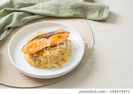 fried rice with grilled salmon fillet steak fried rice with grilled salmon fillet steak 109478471