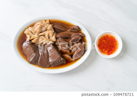 stewed duck offal in brown soup 109478721