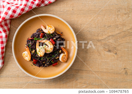stir-fried black spaghetti with garlic and shrimps stir-fried black spaghetti with garlic and shrimps 109478765