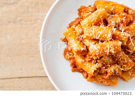 Rigatoni pasta bolognese with cheese 109478822