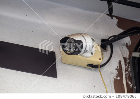 The CCTV Camera is Currently Working to Protect Against External Theft Around the House Building The CCTV Camera is Currently Working to Protect Against External Theft Around the House Building 109479065