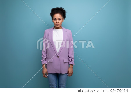 young pretty latin woman dressed in lilac jacket isolated studio background with copy space 109479464
