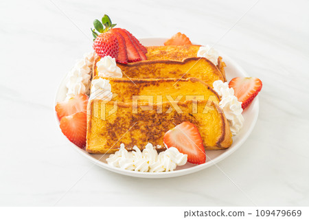 french toast with fresh strawberry and whipping cream 109479669