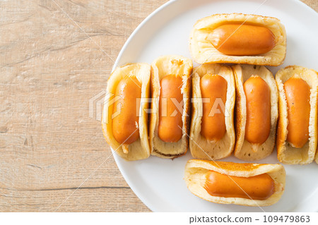 flat pancake roll with sausage 109479863
