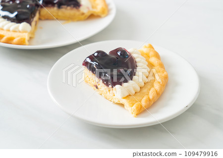Blueberry Cheese Pie on white plate Blueberry Cheese Pie on white plate 109479916