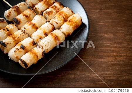 grilled tube shaped fish paste cake skewe or tube squid skewer 109479926