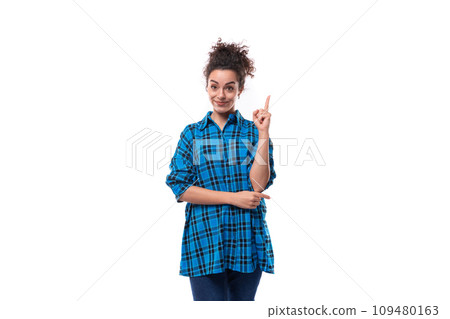 young caucasian curly lady dressed in a plaid shirt is inspired by the idea young caucasian curly lady dressed in a plaid shirt is inspired by the idea 109480163