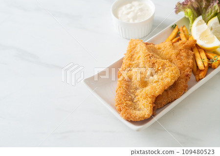 fish and chips - fried fish fillet with potatoes chips fish and chips - fried fish fillet with potatoes chips 109480523