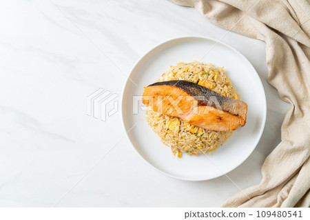 fried rice with grilled salmon fillet steak fried rice with grilled salmon fillet steak 109480541