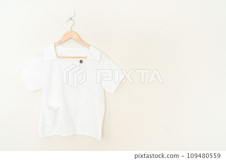 beautiful woman shirt hanging on wall 109480559