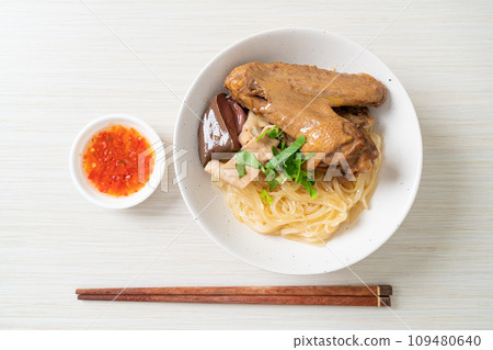 dried noodles with braised duck in white bowl dried noodles with braised duck in white bowl 109480640