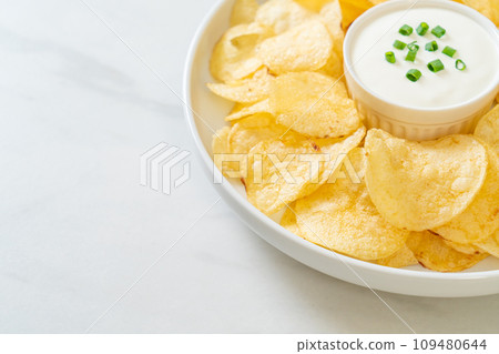 potato chips with sour cream potato chips with sour cream 109480644