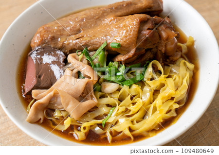 egg noodles with stewed and braised duck in brown soup egg noodles with stewed and braised duck in brown soup 109480649