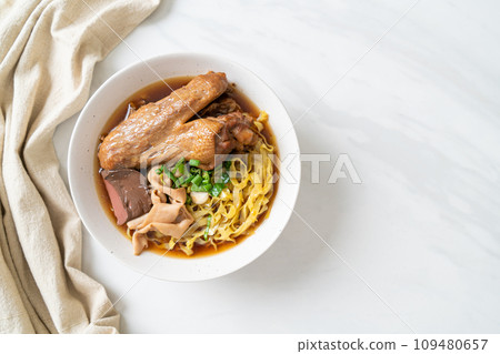 egg noodles with stewed and braised duck in brown soup egg noodles with stewed and braised duck in brown soup 109480657