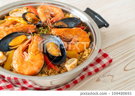 Seafood Paella with prawns, clams, mussels on saffron rice Seafood Paella with prawns, clams, mussels on saffron rice 109480691